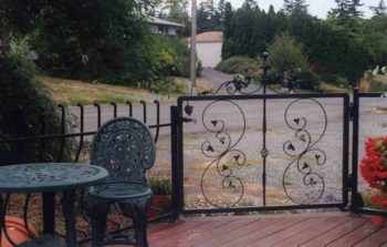 This is our signature gate and Mediterranean style balcony railing.  The curved style pickets give a railing some depth and unique character. deck_gate-04.jpg