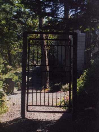 This tall gate was designed to frame in the entry way to the home.  It also functions as a deer fence.  This is more of a contemporary style. tall_gatec-06.jpg