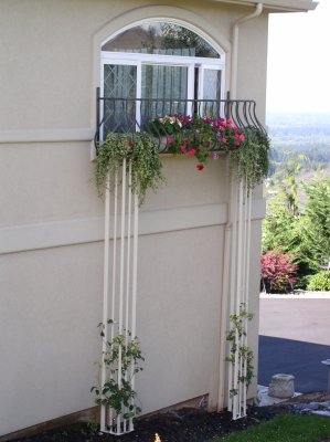 The trellis legs allowed the homeowners to plant climbing plants and really dress up the outside in style.